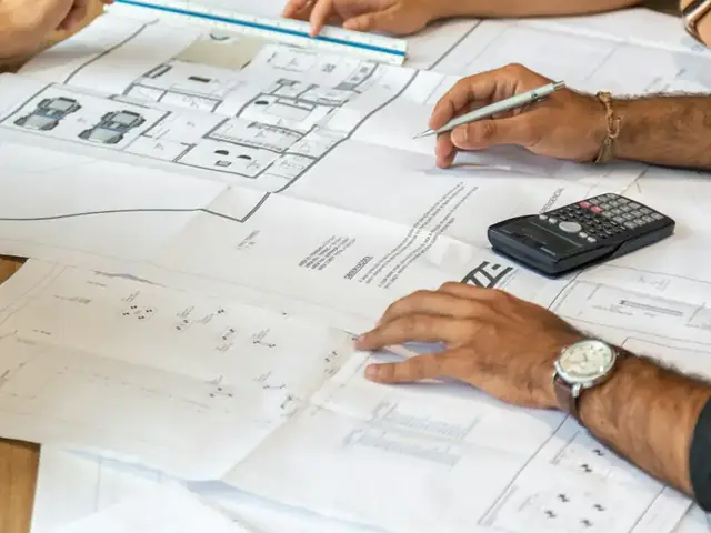 Building plans and drawings on a desk